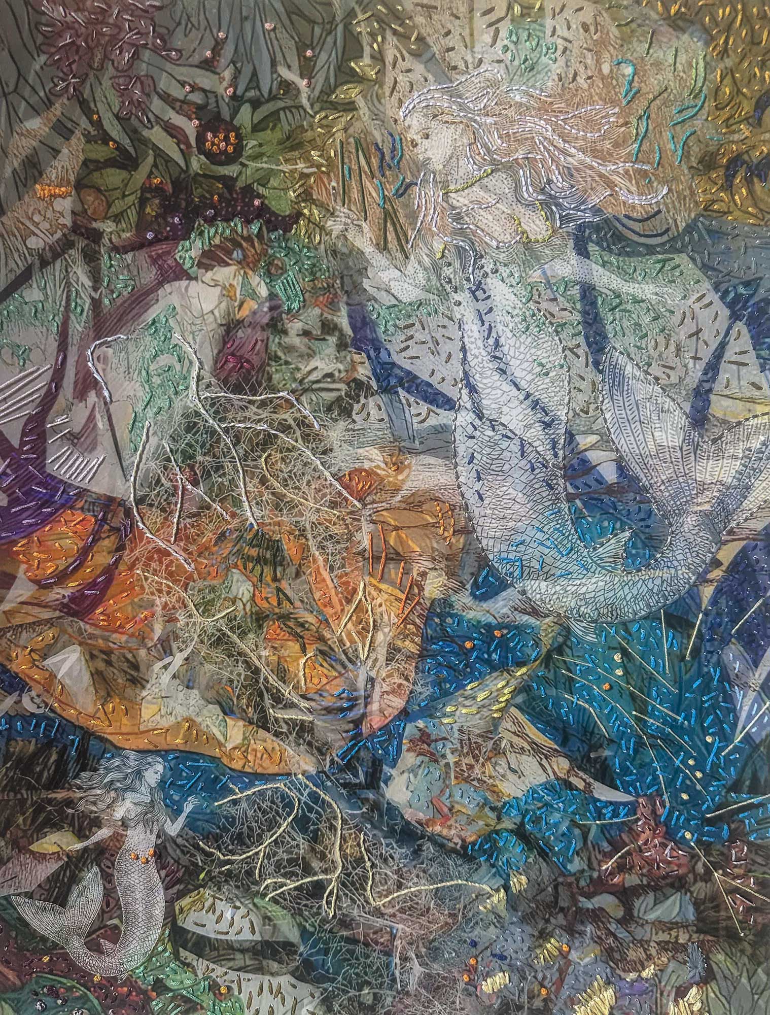 In the Garden of the Nereids — mixed media portrait with embroidered botanicals by Trinidad-based artist Christine Norton, mythological Caribbean scene.